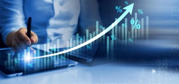 jklj | Axxcess Platform Businessperson writing on a tablet with a glowing upward trend line and percent symbols representing growth analytics in a blue-toned dashboard.